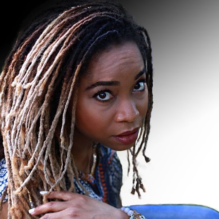Black woman with beautiful long balayge ombre dyed dreadlocks on a faded background