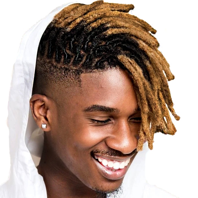 Young black man smiling in a white hoodie wearing brown ombre faux locs that are short and only to his nose length.