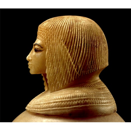 Small ivory sculpture of head of a pharoah queen with long even dreadlocks.