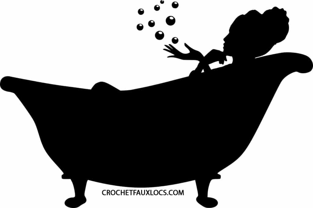 Woman laying down in a bath tub and relaxing bubble bath.