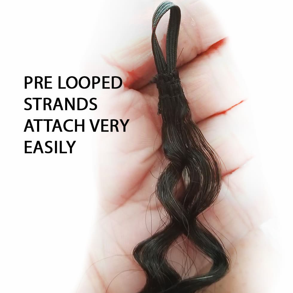 Pre looped strands of hair on a hand that are meant to attach to mermaid locs.