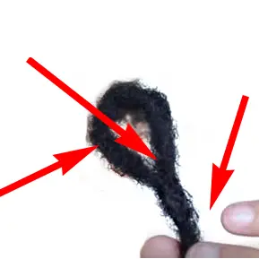 Pre loop faux loc hair in fingertips with directional arrows