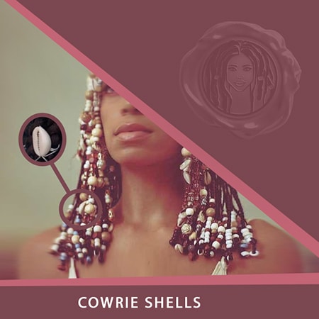 Cowrie shells on dreadlocks or faux locs hair with seashells or cowrie dreadlock accessories