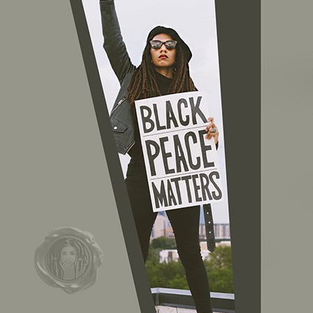 Colored woman wearing dark clothes and holding a black peace matters sign with her black dreadlocks.