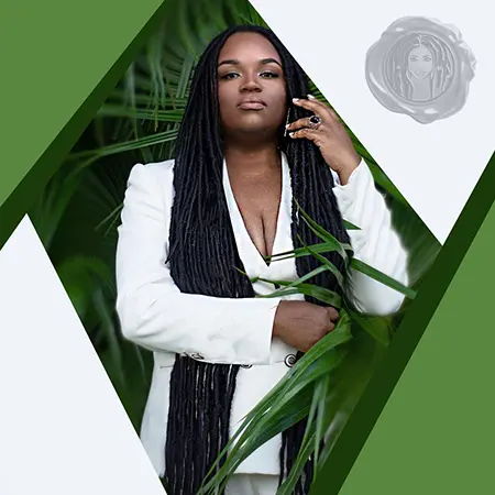 Black woman demonstrating black power and beauty with long black faux locs hair while wearing a nice elegant white suite.