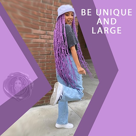 Black girl wearing stylish 2021 trends with long purple faux locs crochet hair under a nice denim hat infant of a brick wall.