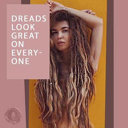 White girl with long blonde dreadlocks against a yellow background.