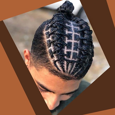 Flat top cornrow box braids hairstyle design on spanish male outside during winter.