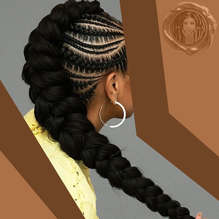 Black girl model holding long beautiful medium length box braids in an ebony dark black hair color.