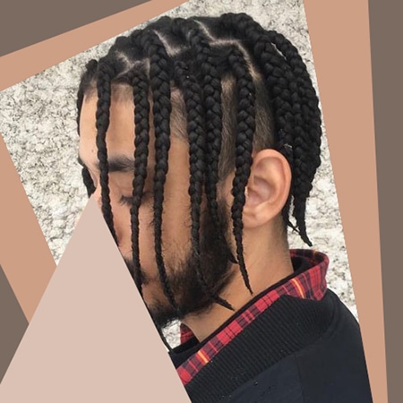Light skinned male looking down with his short length black box braid hairstyle.