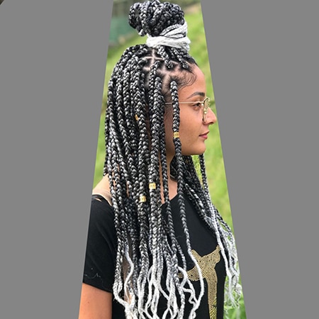 Metallic grey and white box braided hairstyle colors on light skin black woman.