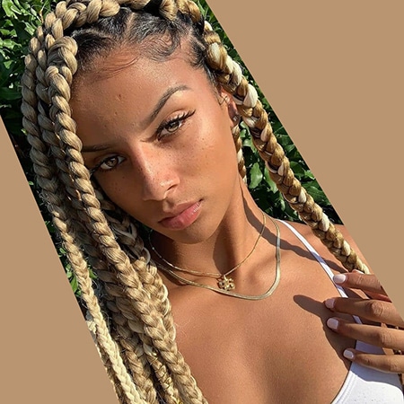Light skin model from africa with beautiful sandy brown box braid crochet hair colors.